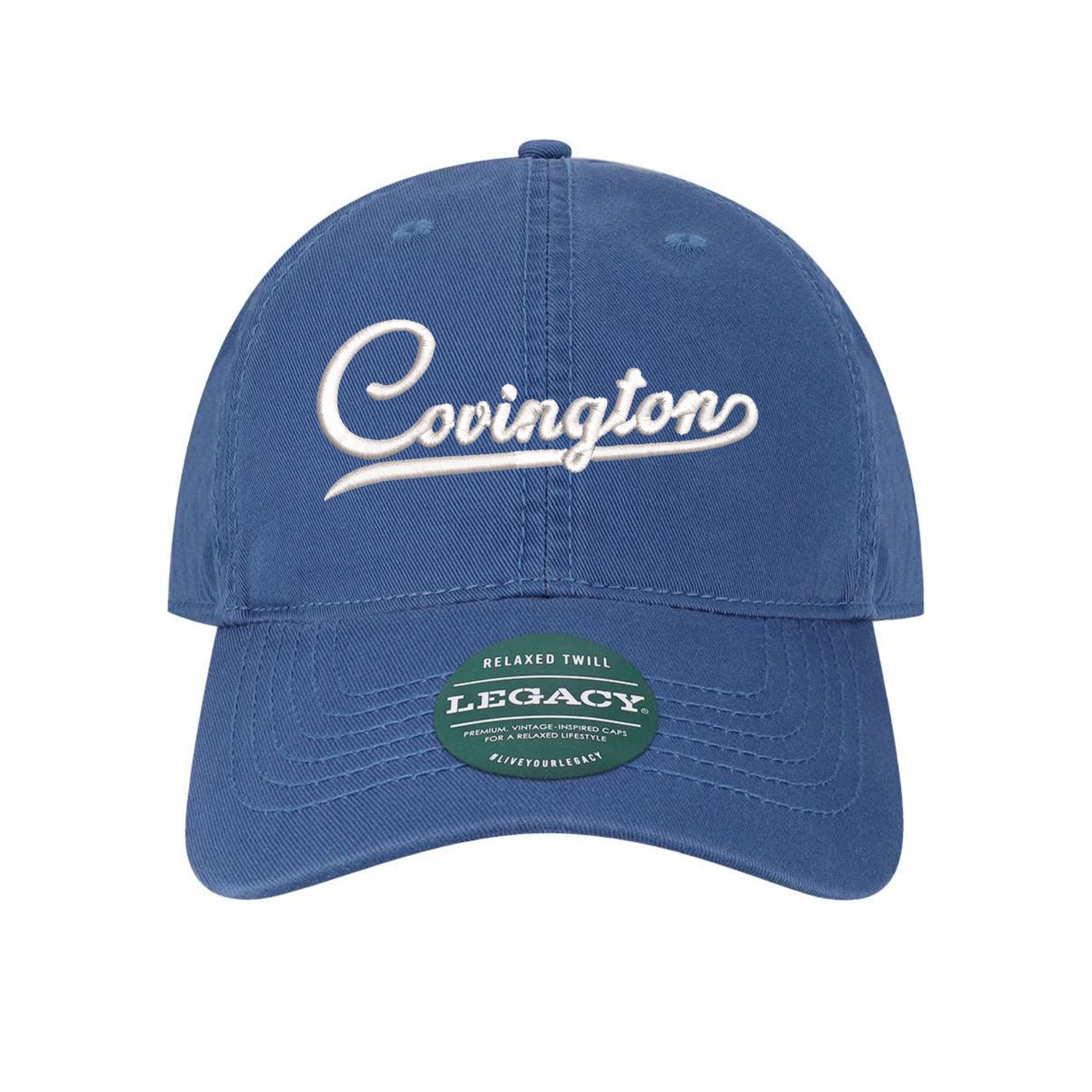 Royal Blue Embroidered baseball hat with Covington design in white thread