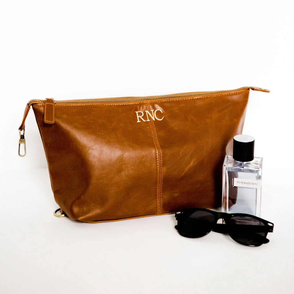 mens dopp kit brown leather with monogram RNC at top of bag