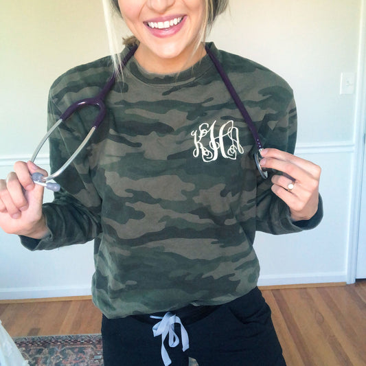 nurse wearing pullover camo crewneck with custom embroidered monogram