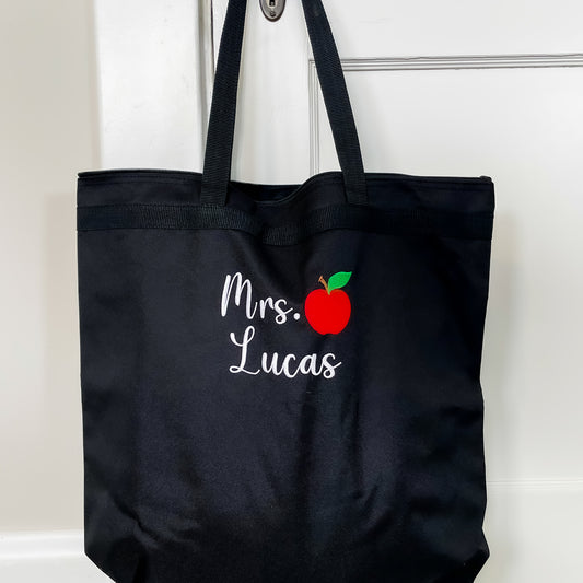Black tote with custom name and small apple embroidery