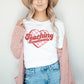 woman wearing a teaching sweethearts printed white in pink and red inktee 