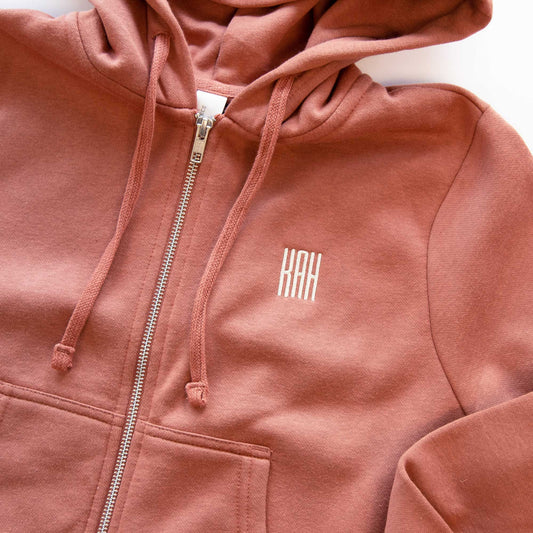 a cropped desert rose full zip jacket with mini monogram embroidery on the left chest