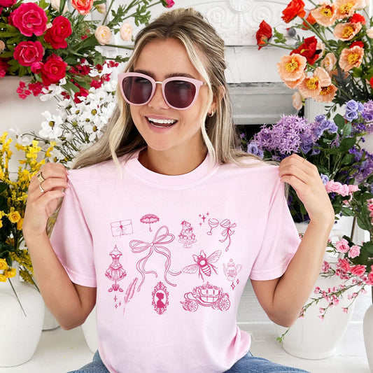 girl wearing a blossom comfort colors tee with a briderton inspired icon print