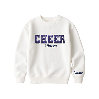 bleached linen boxy crewneck sweatshirt with navy glitter applique embroidery reading cheer with vipers embroidered in a script font underneath, and an optional name embroidery in a script font on the left sleeve 