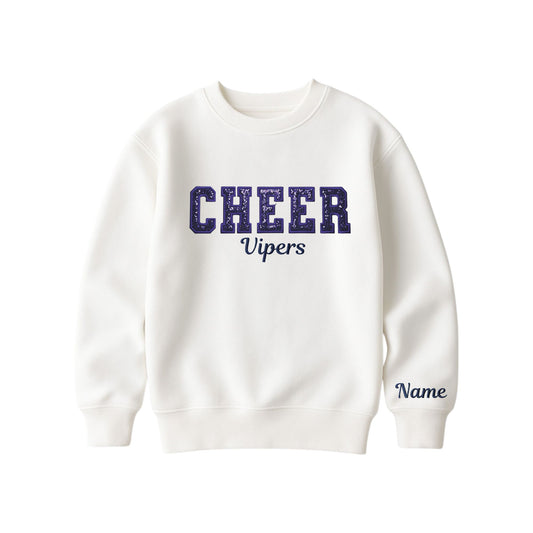 bleached linen boxy crewneck sweatshirt with navy glitter applique embroidery reading cheer with vipers embroidered in a script font underneath, and an optional name embroidery in a script font on the left sleeve 