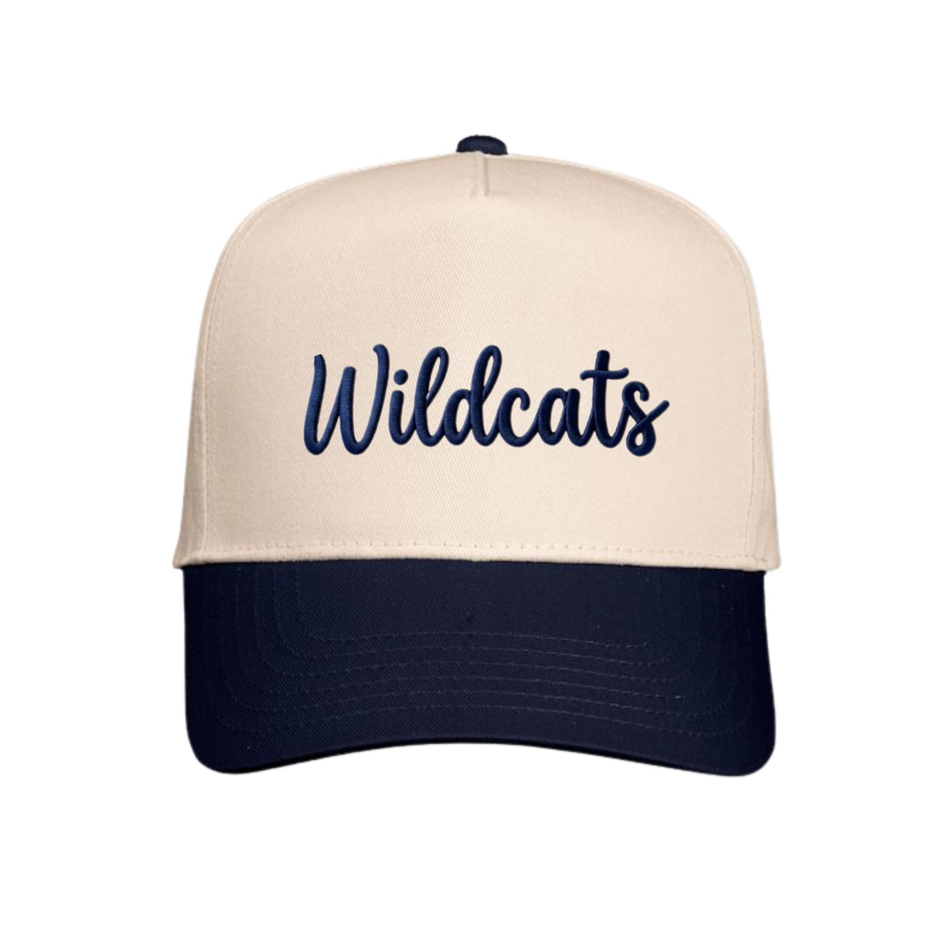A structured baseball cap with a cream-colored front panel and brim, featuring the word 'Wildcats' embroidered in navy blue script across the front, with a dark navy blue curved brim and matching button on top.