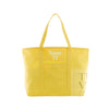A bright yellow canvas tote bag with two shoulder straps, featuring a white embroidered 'Name' text and bow design on the front pocket, and a gold-toned printed logo on the lower right front panel.