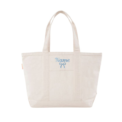 NATURAL CANVAS TOTE WITH POWDER BLUE NAME AND BOW EMBROIDERED DESIGN