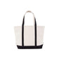 Natural tote bag with black trim on a white background