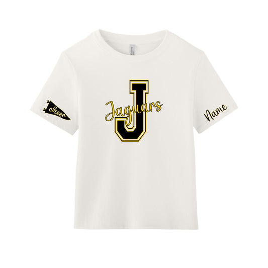 An off-white short-sleeve t-shirt with a black and gold 'Jaguars' graphic on the chest, a black and gold 'Cheer' pennant on the right sleeve, and 'Name' printed in black on the left sleeve.