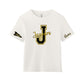 An off-white short-sleeve t-shirt with a black and gold 'Jaguars' graphic on the chest, a black and gold 'Cheer' pennant on the right sleeve, and 'Name' printed in black on the left sleeve.