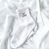 white crew socks with custom #1 dad embroidery in black thread