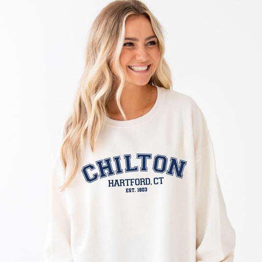 girl wearing oversized sweet cream crewneck with Chilton Hartford, CT print