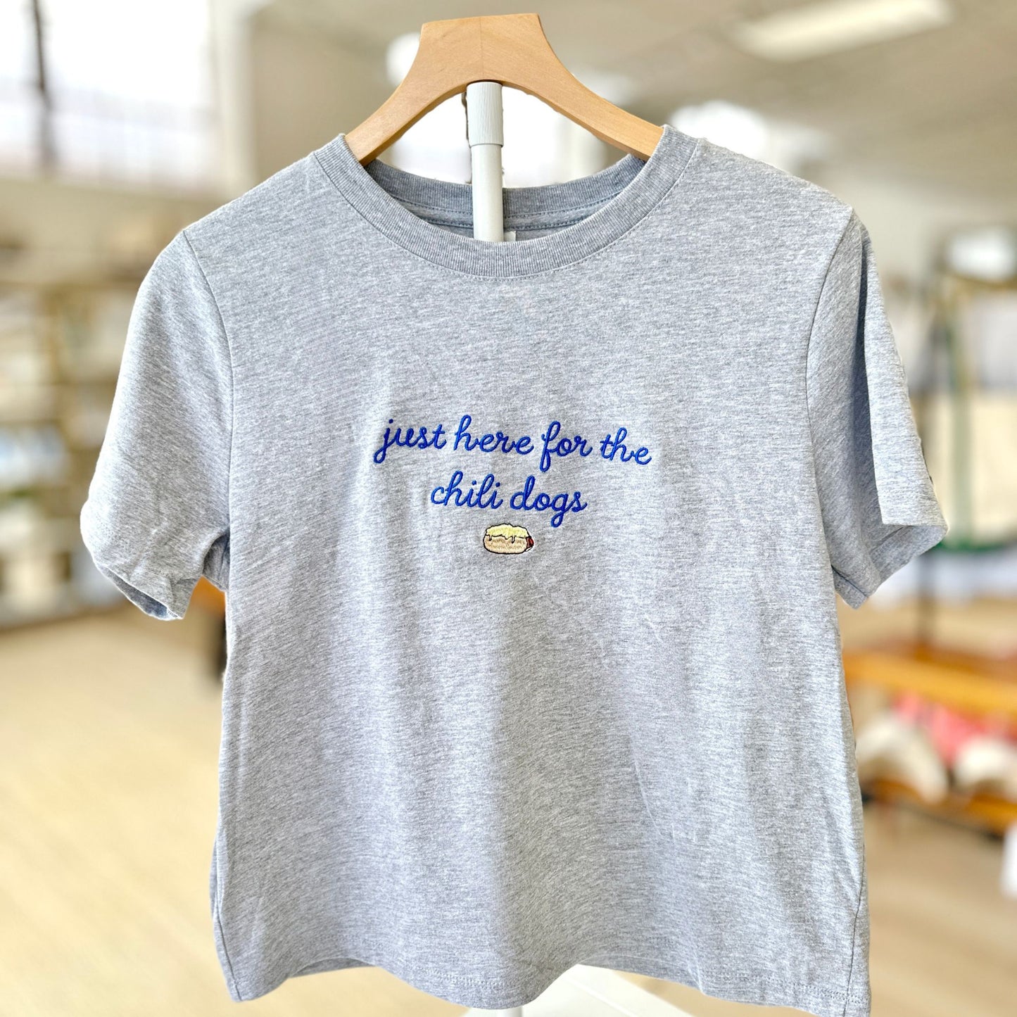 athletic heather bella and canvas boxy tee with a cute script just here for the chili dogs embroidered design on the center chest