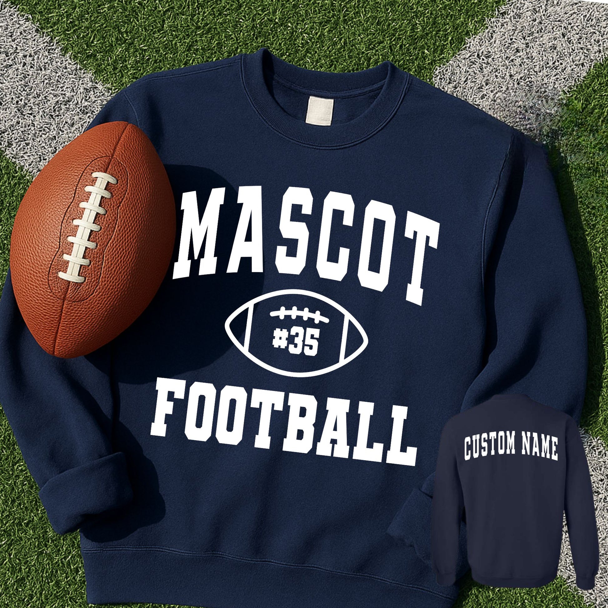 front and back image of a navy blue sweatshirt with custom mascot, player number, and custom name printed design in white. sweatshirt is laying on football green
