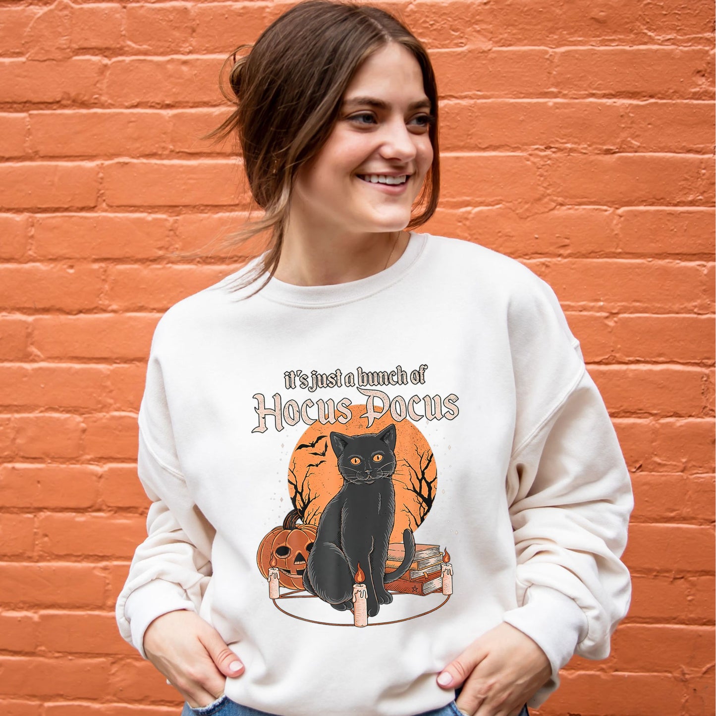 girl wearing a sweet cream crewneck sweatshirt with a custom it's just a bunch of hocus pocus cat print