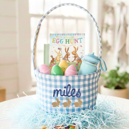 Easter basket with colorful eggs, a book, and personalized details on a light background