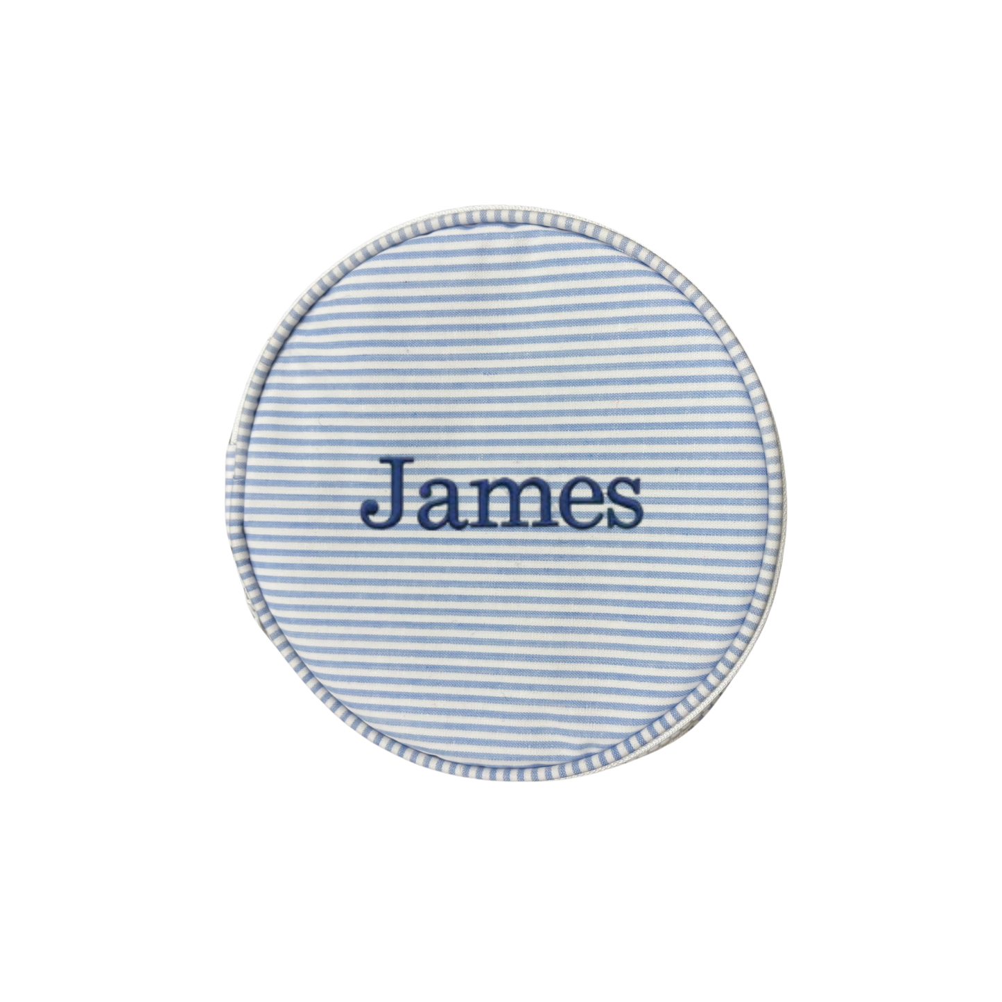 Round blue and white striped fabric patch with 'James' embroidered on a white background