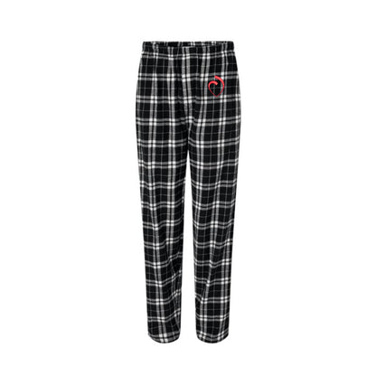 black and white plaid pajama pants with the sacred heart schools logo embroidered in red on the left leg pant pocket area