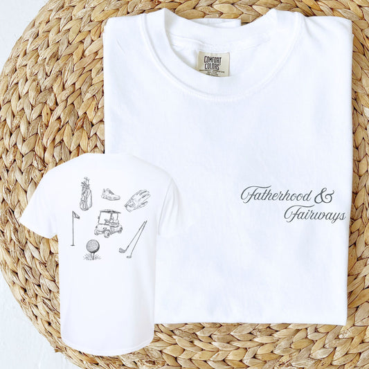 white comfort colors t-shirt with a fatherhood & fairways print on the front left chest and vintage inspired sketched golf icons on the back 