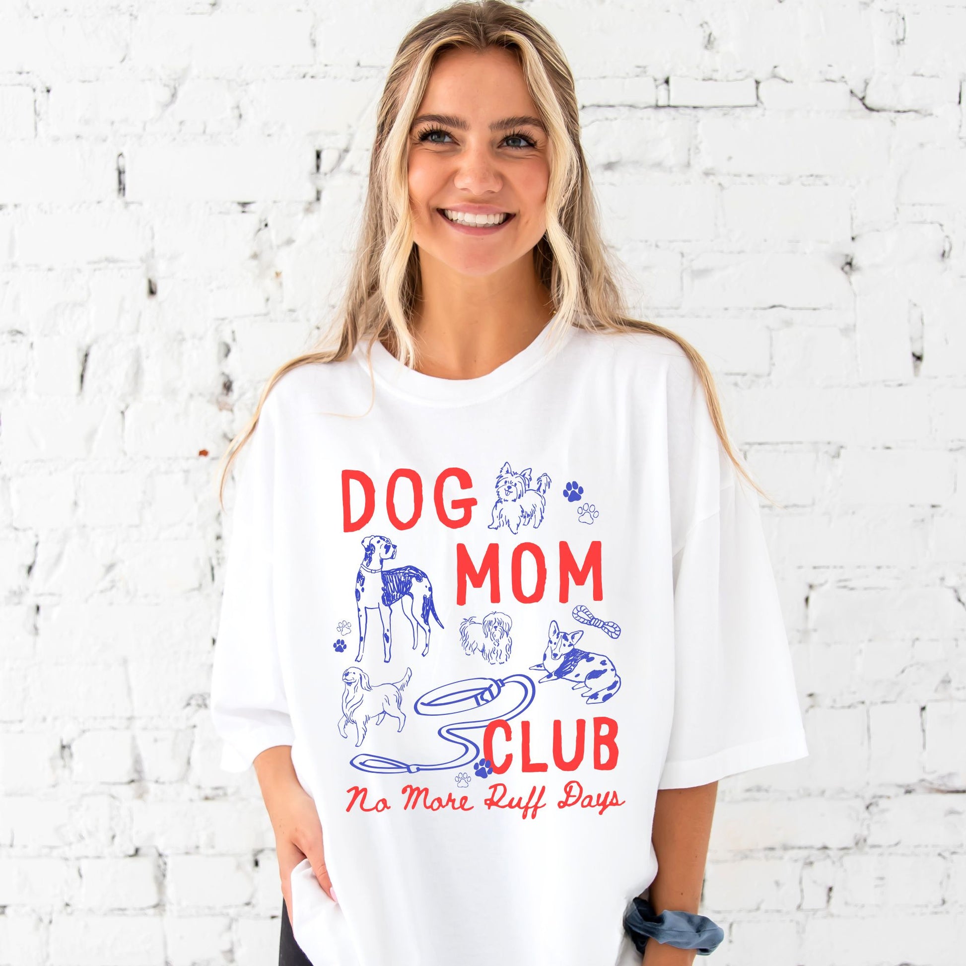 girl wearing oversized white comfort colors t-shirt with a large dog mom club dog doodle print 
