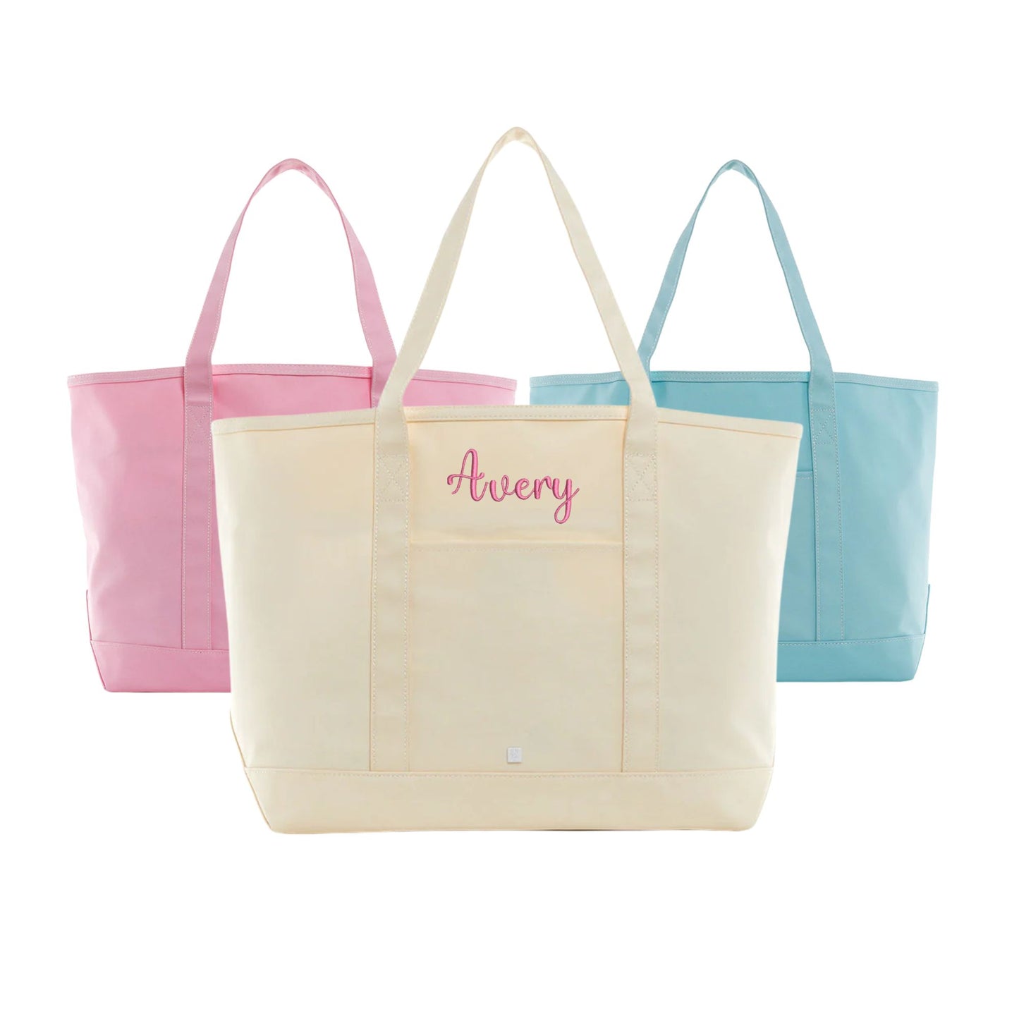maxi coated canvas totes in natural, peony, and lake blue