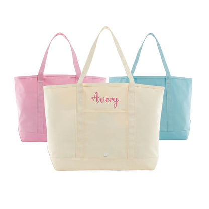 maxi coated canvas totes in natural, peony, and lake blue