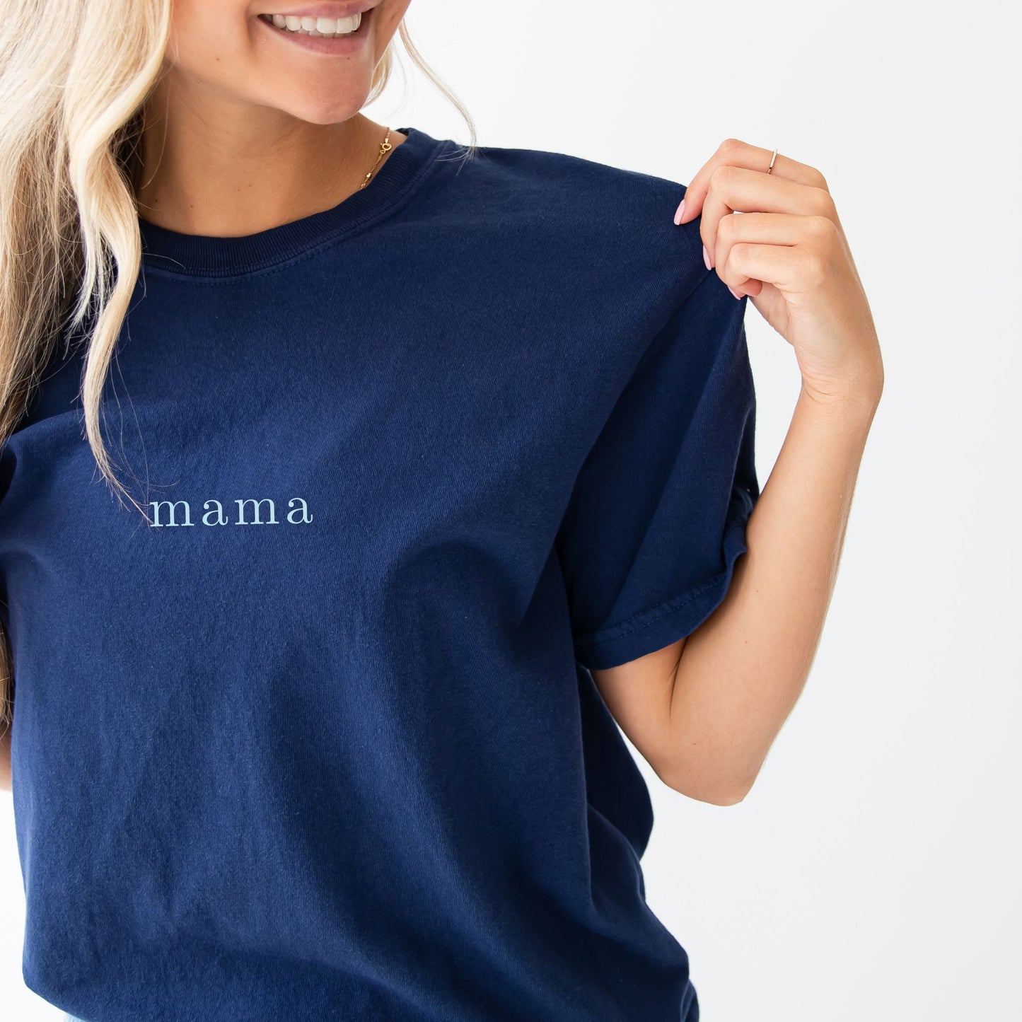 woman wearing a true navy comfort colors tee with custom mama embroidered design in a powder blue thread