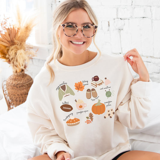 girl wearing a sweet cream sweatshirt with cute girly fall icons printed on the front.