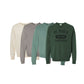 Four sweatshirts in different colors with 'St. Pius X' branding on a white background