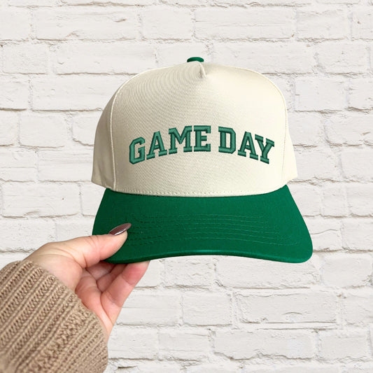 green two tone trucker hat with custom game day embroidered design in green thread