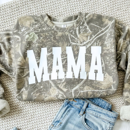 Camouflage sweatshirt with 'MAMA' text on a textured surface