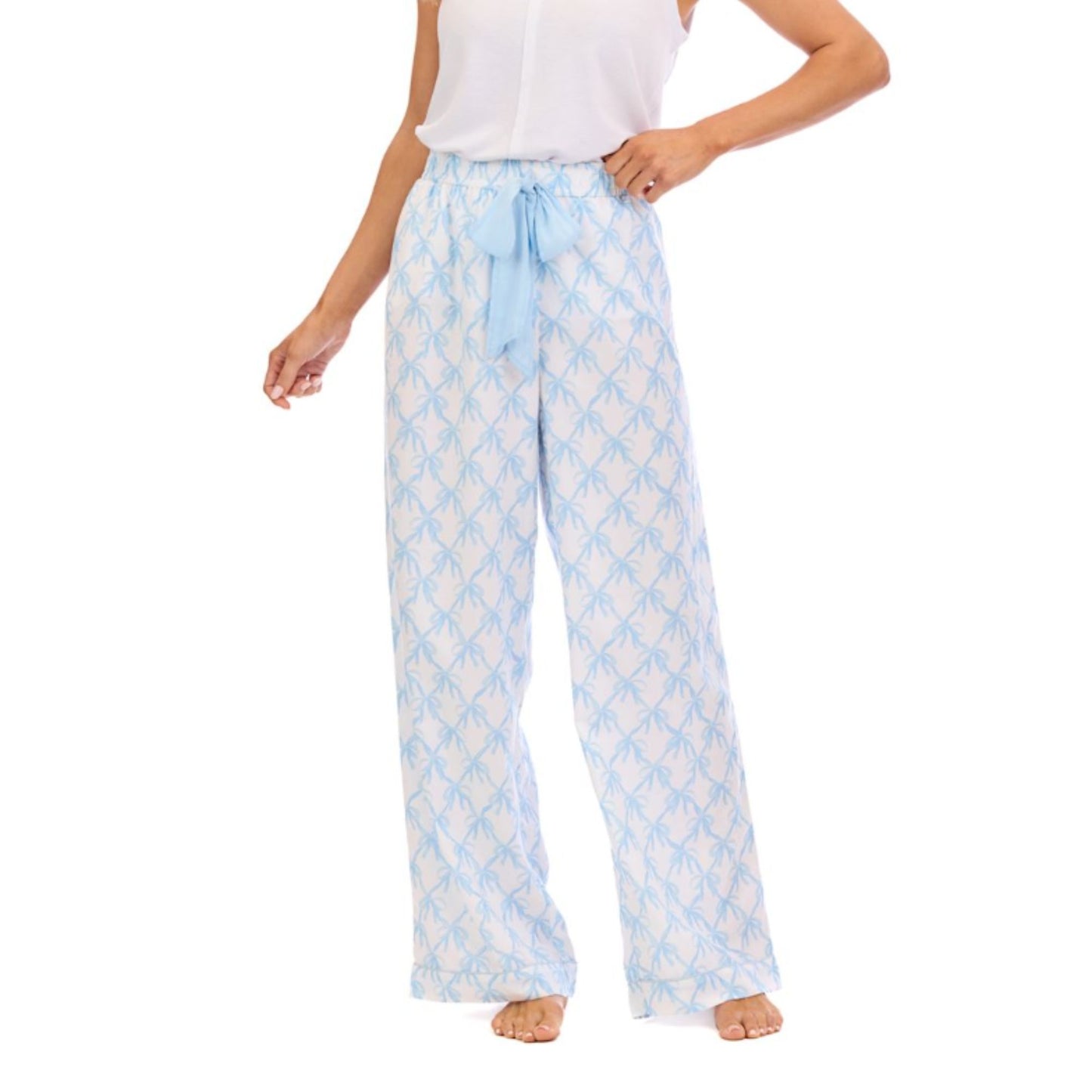 Light blue and white checkered pajama pants worn by a person on a white background