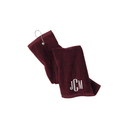 maroon golf towel with custom embroidered monogram in white thread