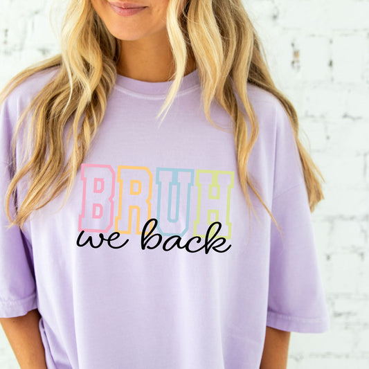 woman wearing an oversized orchid comfort colors t-shirt with a funny bruh we back printed design