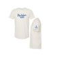 An off-white short-sleeve t-shirt shown from two angles: a front view featuring the blue text 'Montessori mom' and a small heart, and a side/back view showing a blue cross with 'VMH' on the sleeve.