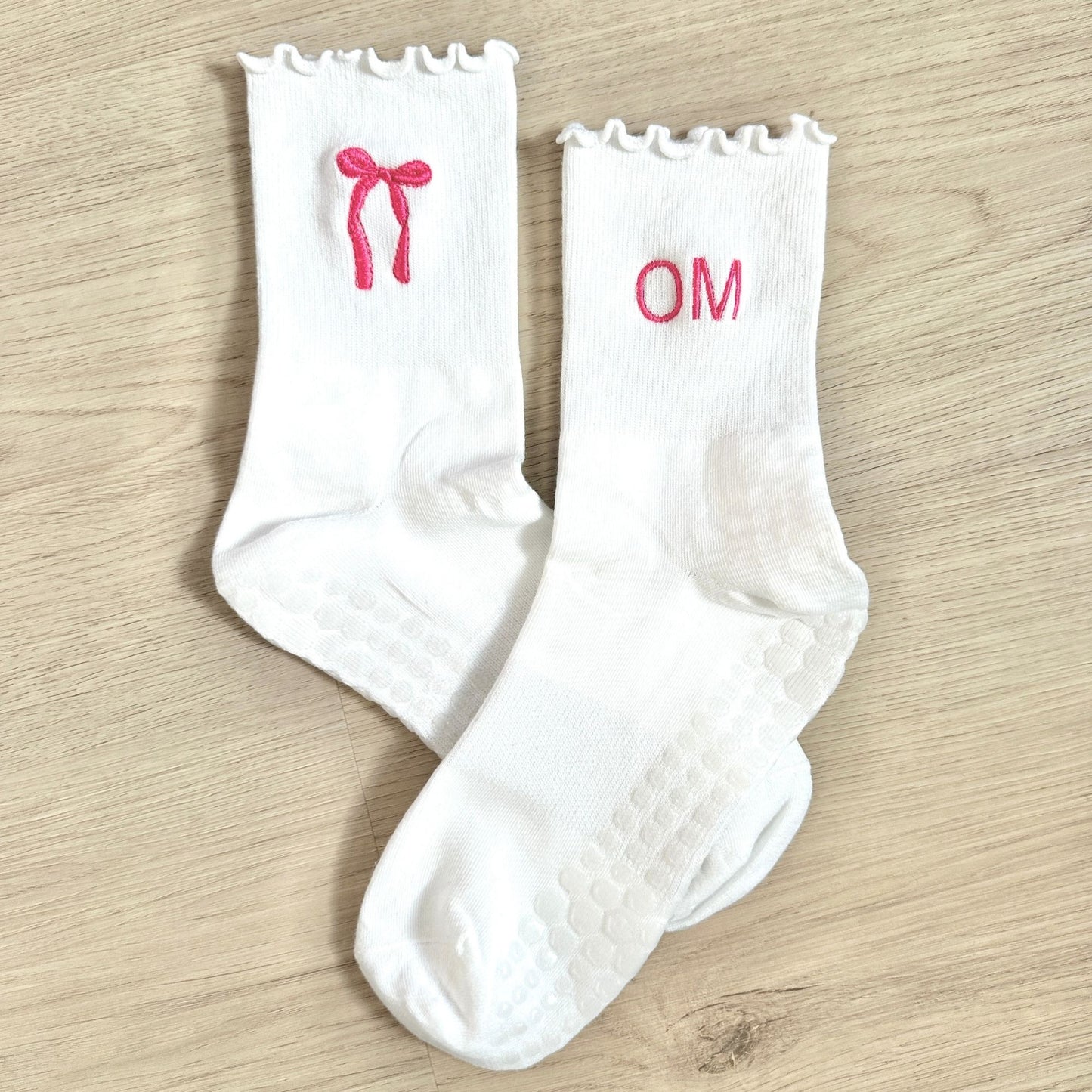 white ruffle grip socks with custom bow and initial embroidery in pink thread