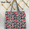 Floral patterned bag hanging on a wooden rack with 'Black Floral' text.