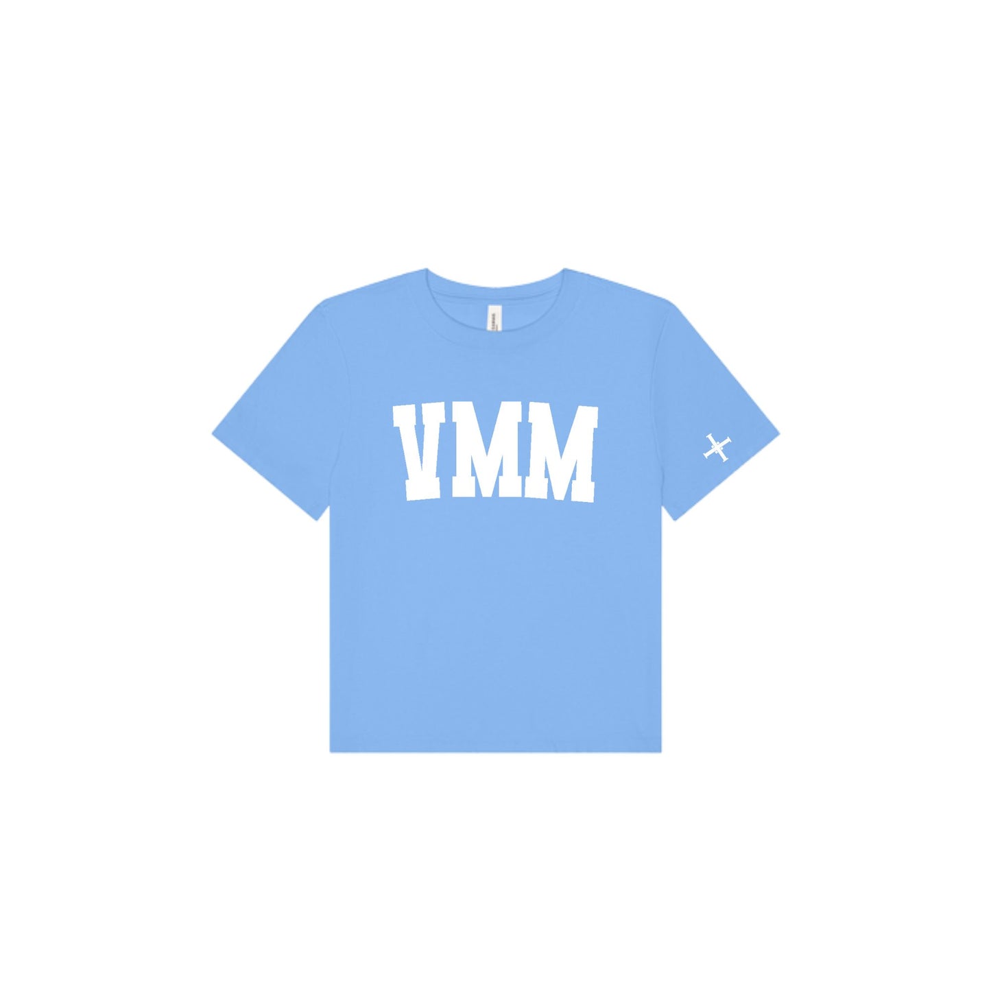 A light blue short-sleeve t-shirt with 'VMM' printed in bold white block letters across the chest and a small white 'cross' logo on the left sleeve, shown on a plain white background.