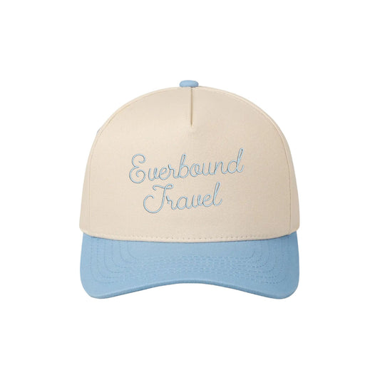 two tone sky blue trucker hat with custom everbound travel embroidered design 