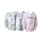 Three tie-dye sweatshirts in different colors on a white background