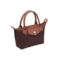 A small brown leather handbag with dual top handles, a front flap closure secured by a gold-tone snap button, and gold-tone hardware, shown on a plain white background.