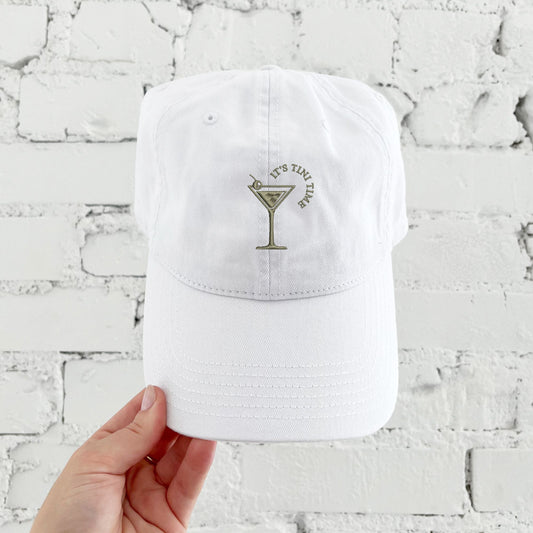 white baseball cap with custom martini glass embroidered design