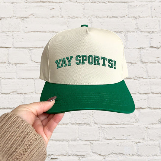 green vintage inspired two-tone trucker hat with custom yay sports embroidered design