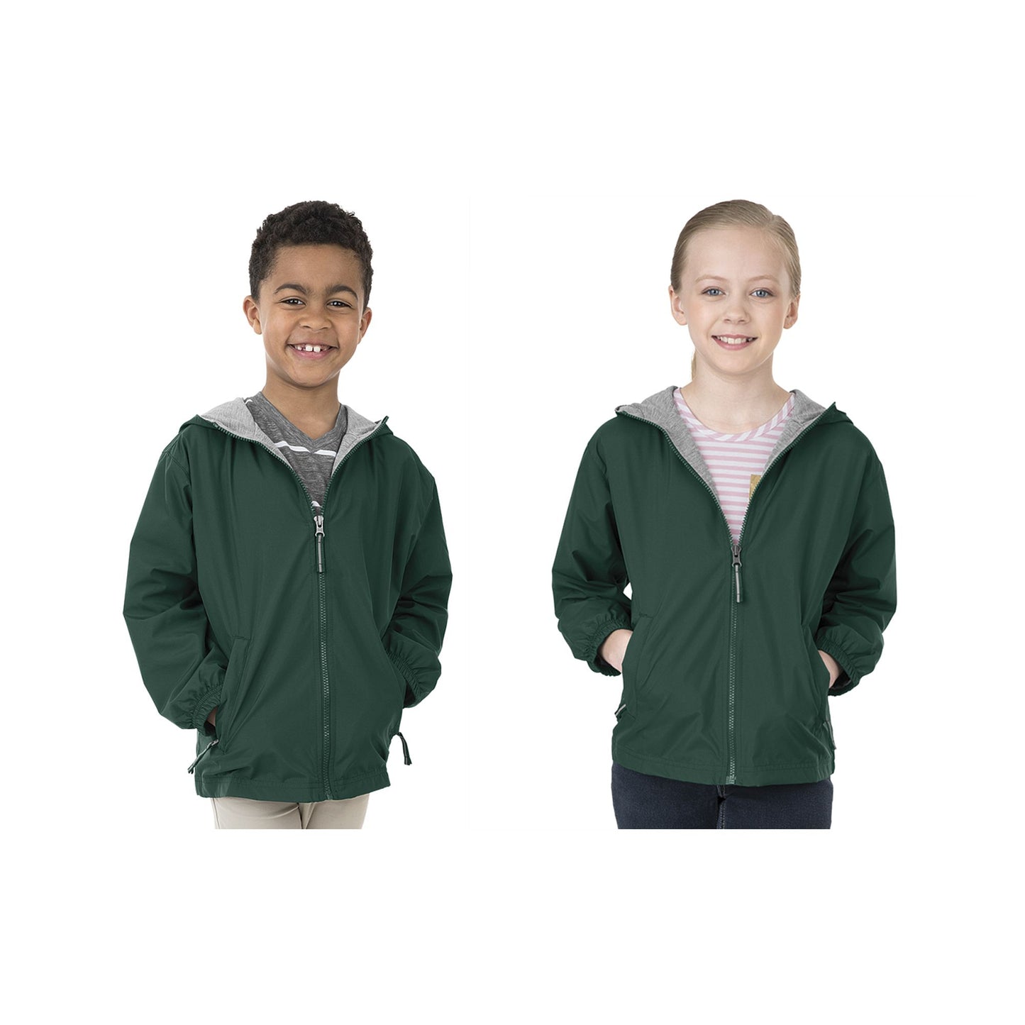Two children wearing green hooded jackets on a white background
