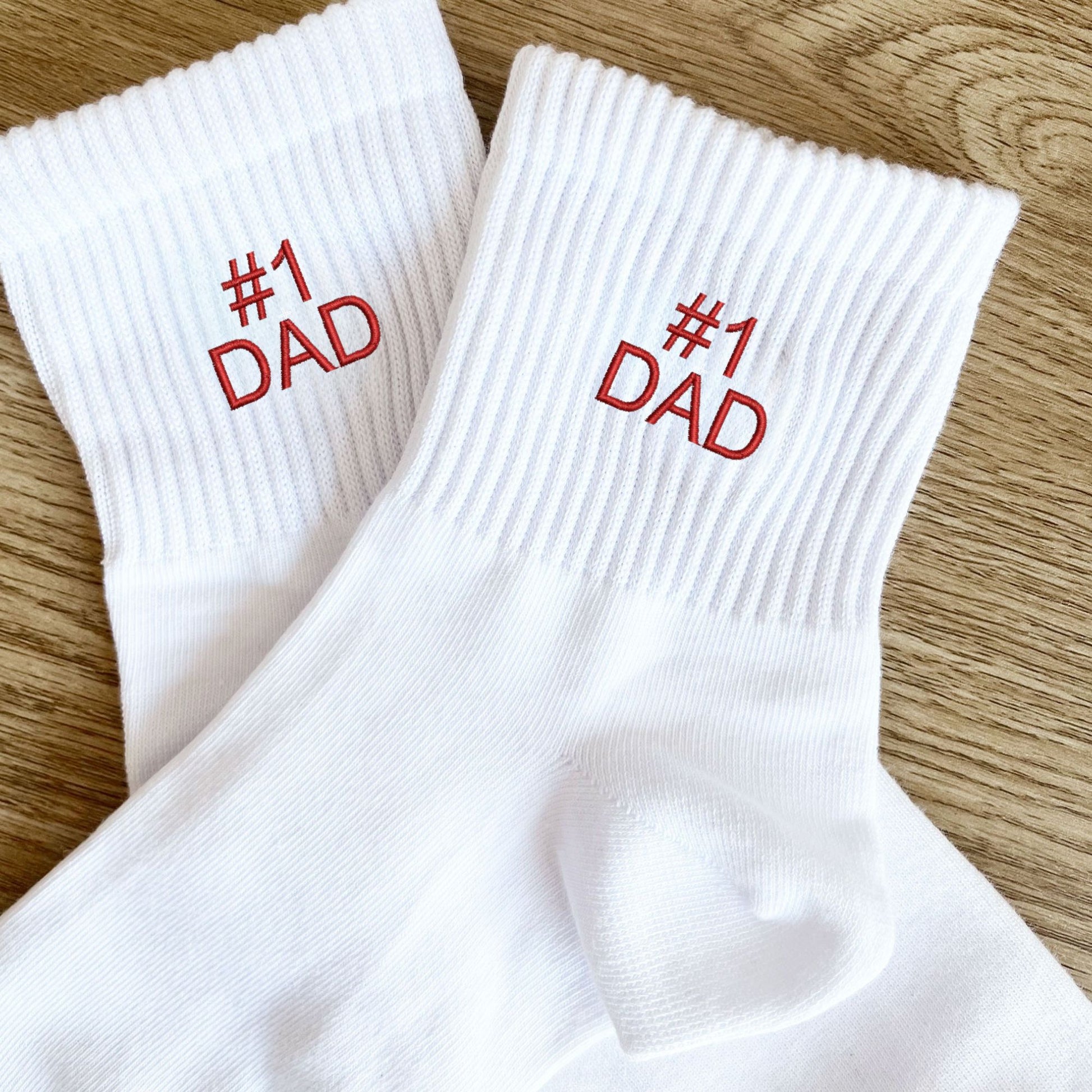 white crew socks with custom #1 dad embroidery in red thread