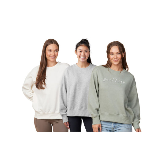 Three women wearing different colored sweatshirts on a white background