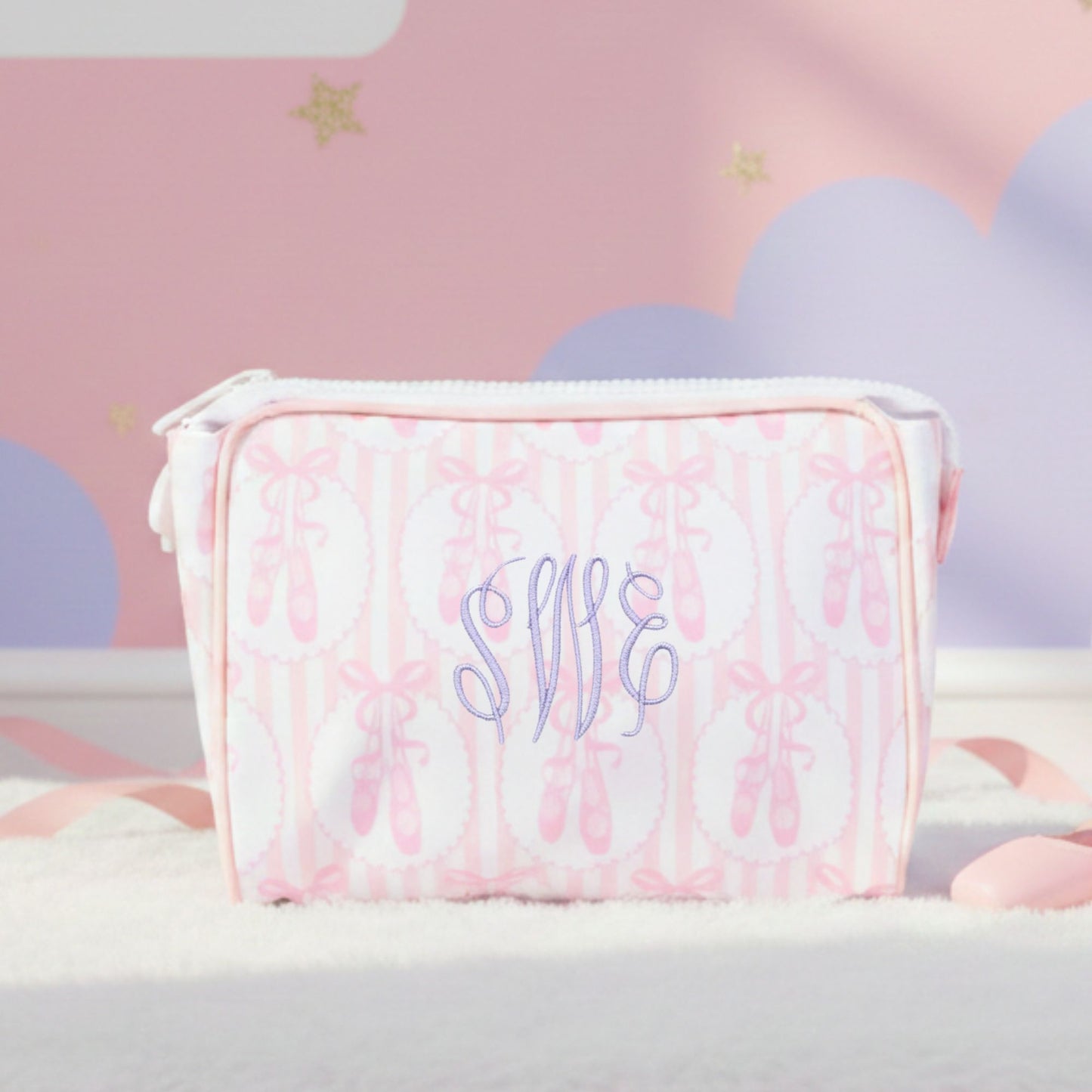 Pink ballet slipper pouch with 'swe' monogram on a soft pink background