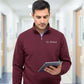 Man wearing a maroon pullover with 'Dr. Wilson' embroidered on it, holding a tablet in a hallway.