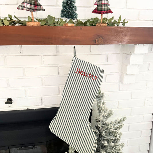 green and natural striped farmhouse stocking with red thread and typewriter font